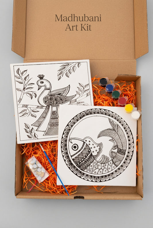 Open cardboard box with mandala art canvass and decorative items with paints and brush