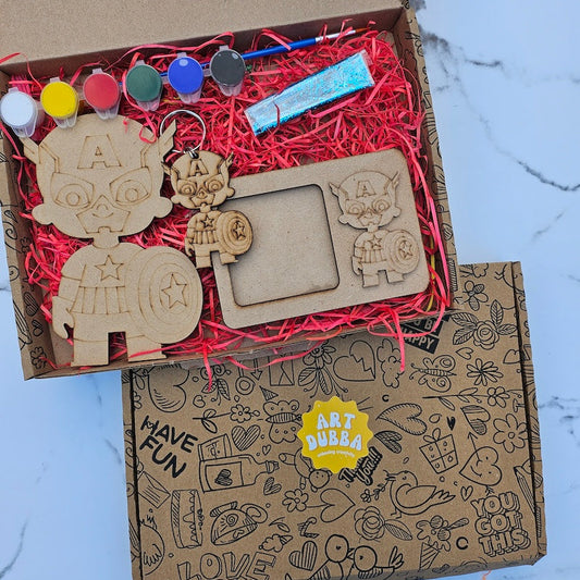 Wooden craft items in a box with decorative elements on a marble surface