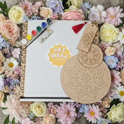 Mandala pieces of wood with 'Art Bubba' logo, paintbrush, and palette on a floral background