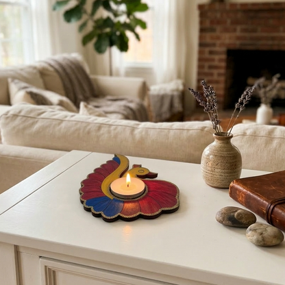 Living room with a white coffee table featuring a colourful peacock tealight holder.