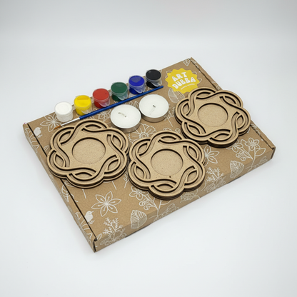 craft kit with laser-cut shapes and paint supplies on a white background