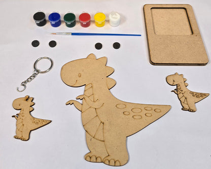 Art Dubba craft kit with dinosaur shapes, paint, and brush on a white background