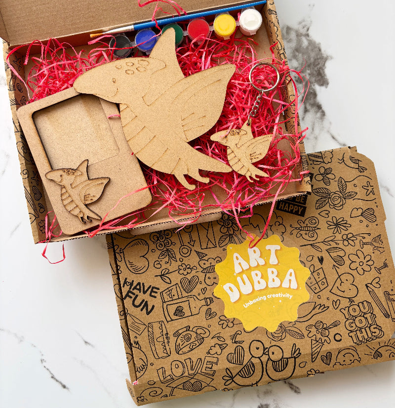 Box of wooden art supplies with 'Art Dubba' branding on a marble surface