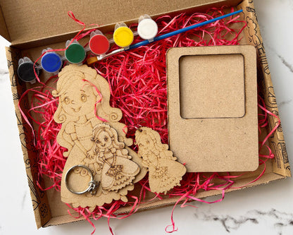 Wooden craft kit with paint, brush, and wooden figures in a cardboard box.