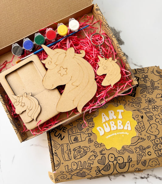 Wooden unicorn crafts and art supplies in a box with 'Art Dubba' branding.